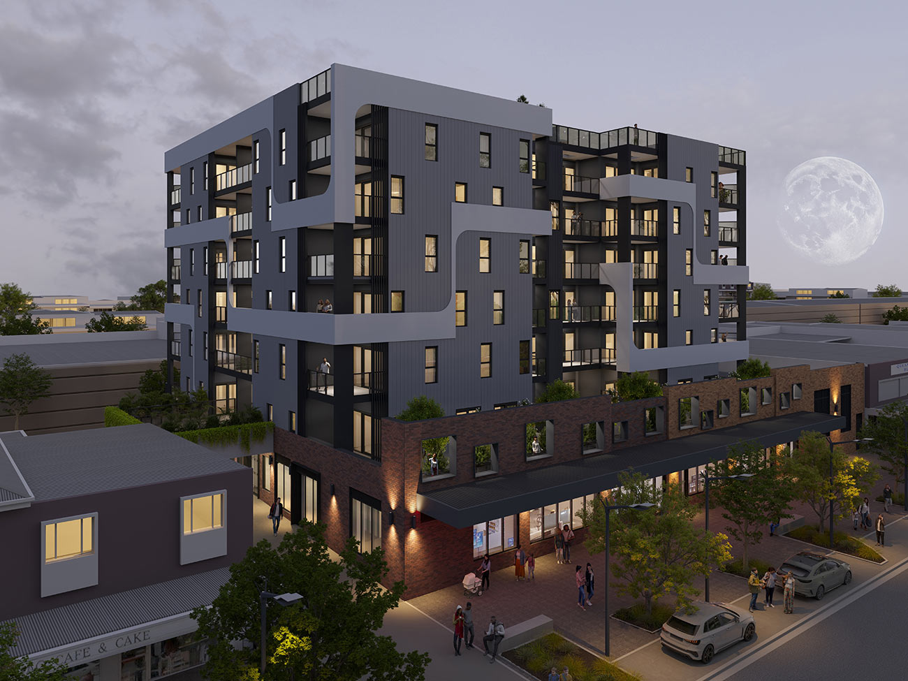 Aerial view of mixed use apartment building with retail ground floor dusk lighting