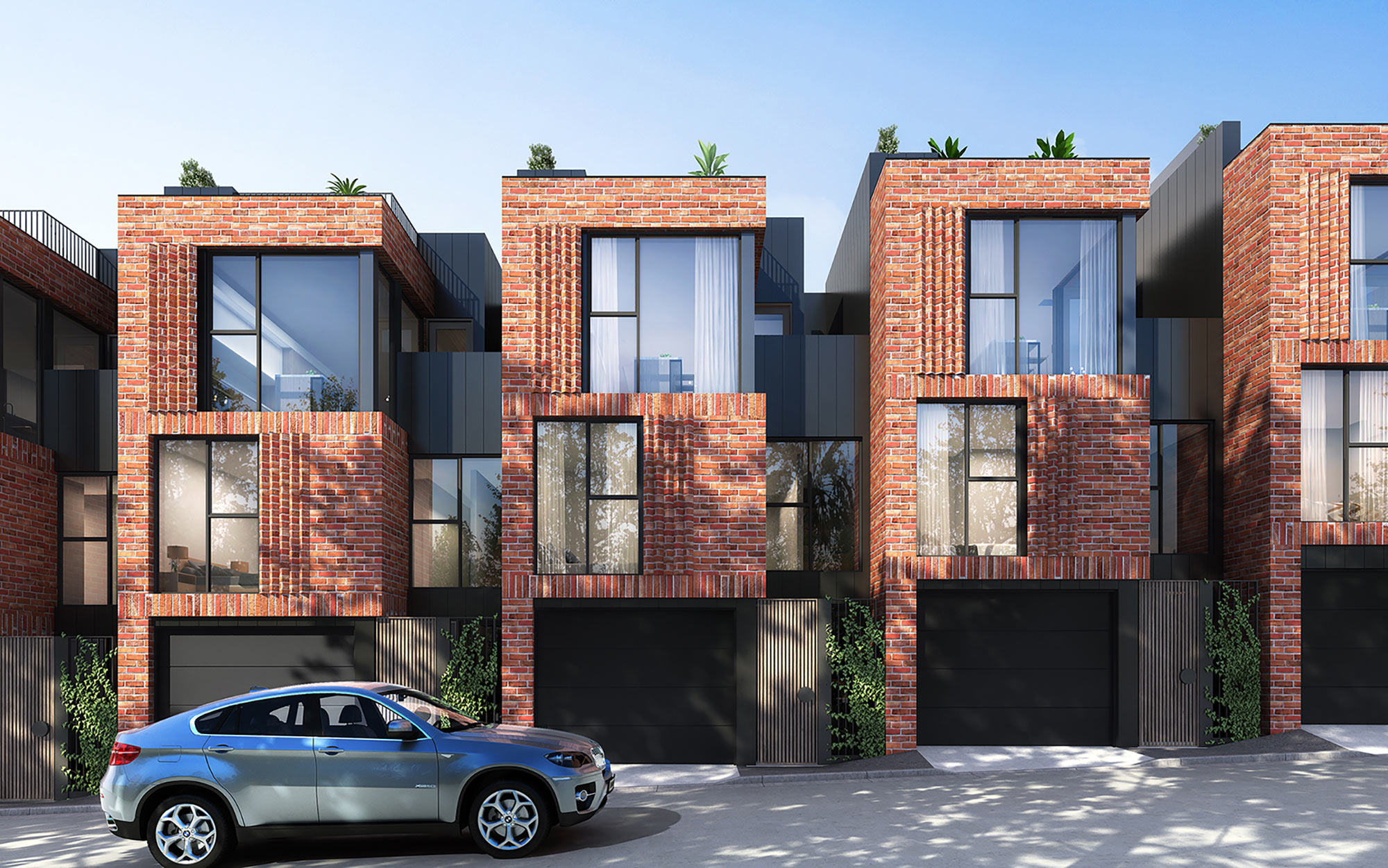 3D render of modern brick townhouses with garages and street frontage