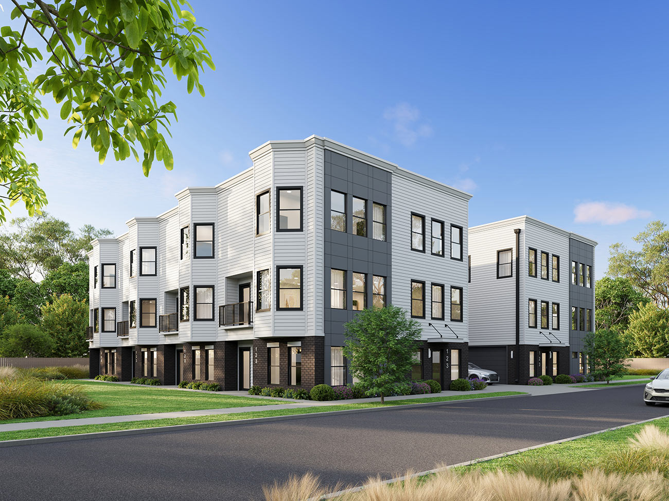 Modern townhouse development with multi-level units and clean urban streetscape design