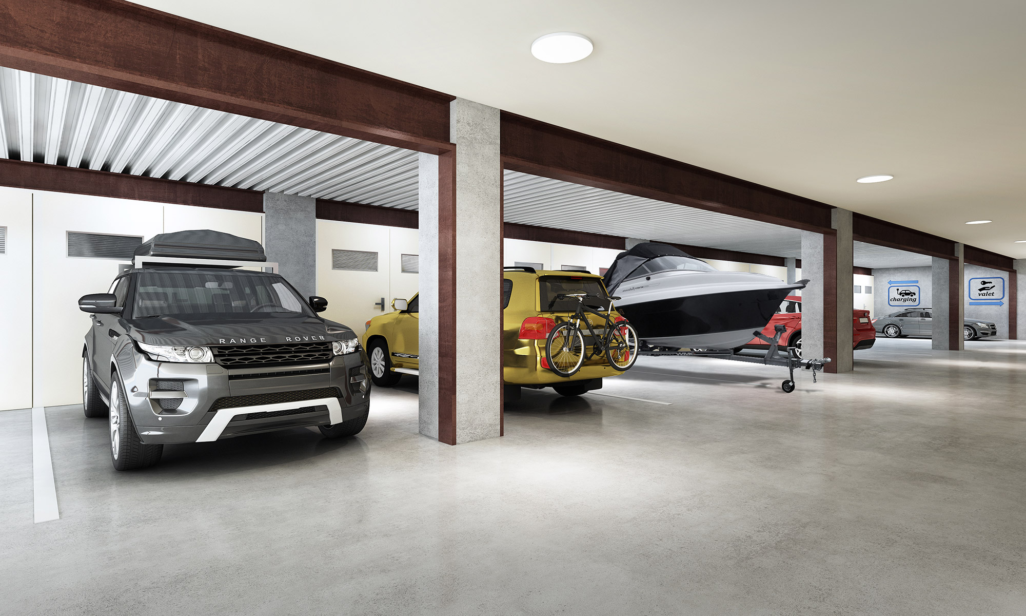 Modern basement car park with private storage units, vehicles and structured concrete columns
