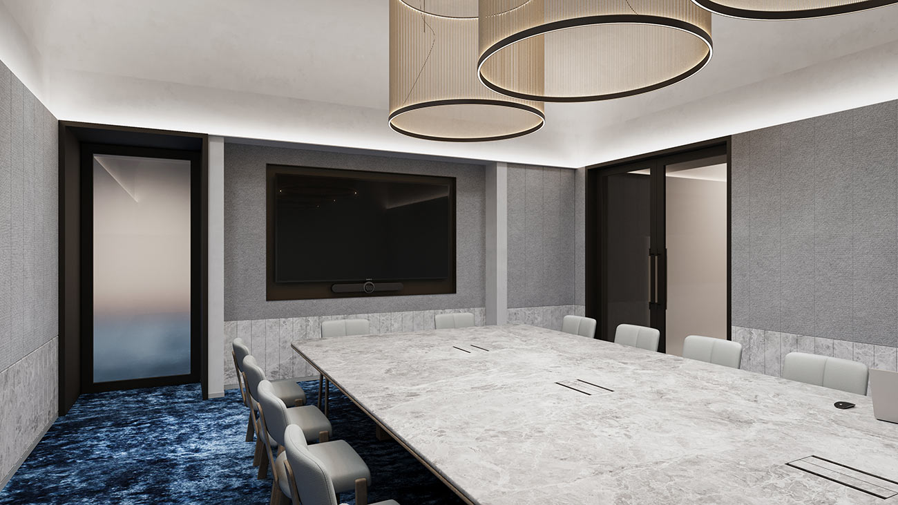 Executive boardroom with large meeting table, video conferencing screen and acoustic wall finishes