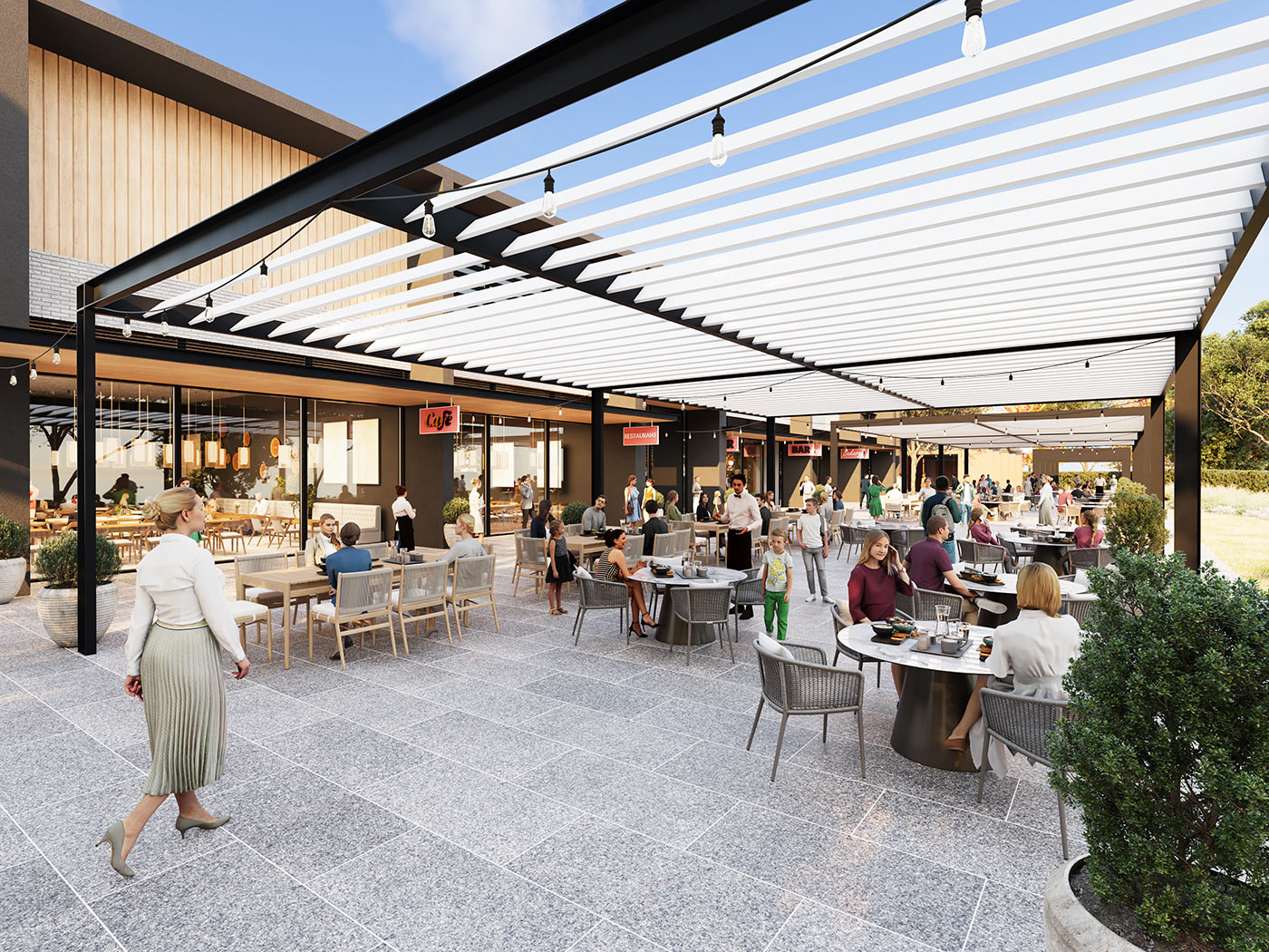 Outdoor dining precinct with pergola structure, restaurants and activated public seating in town centre development