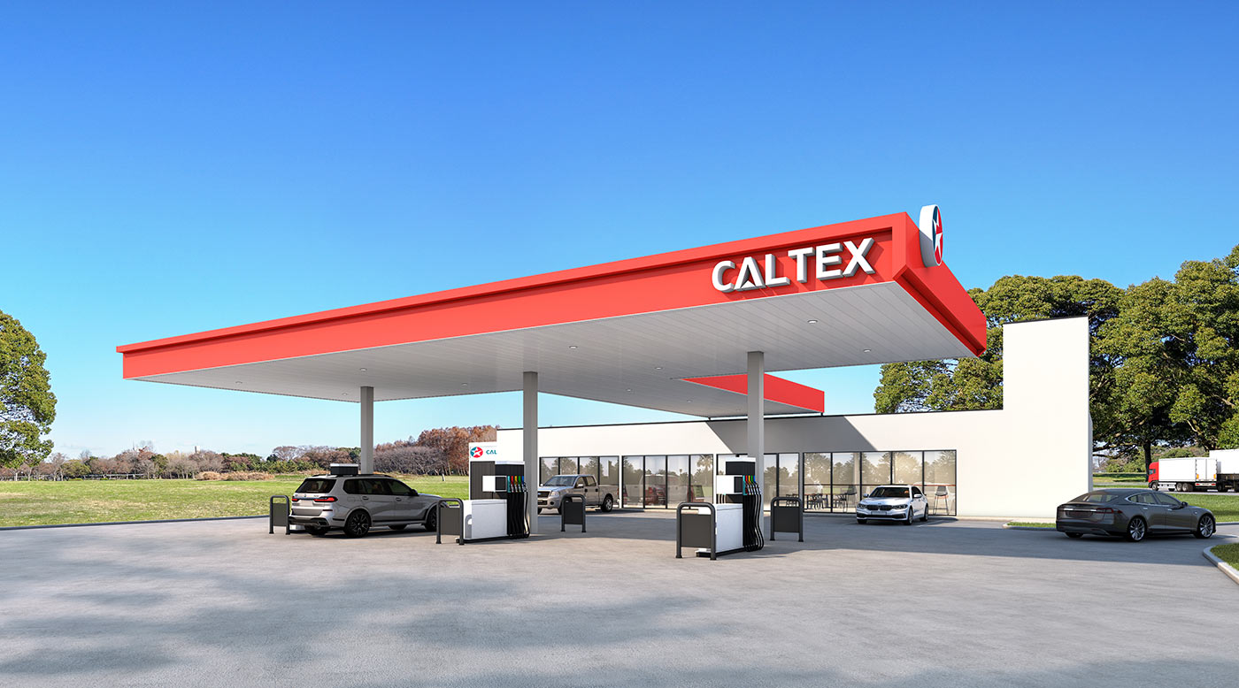 Modern service station forecourt with fuel canopy, convenience retail building and vehicle access