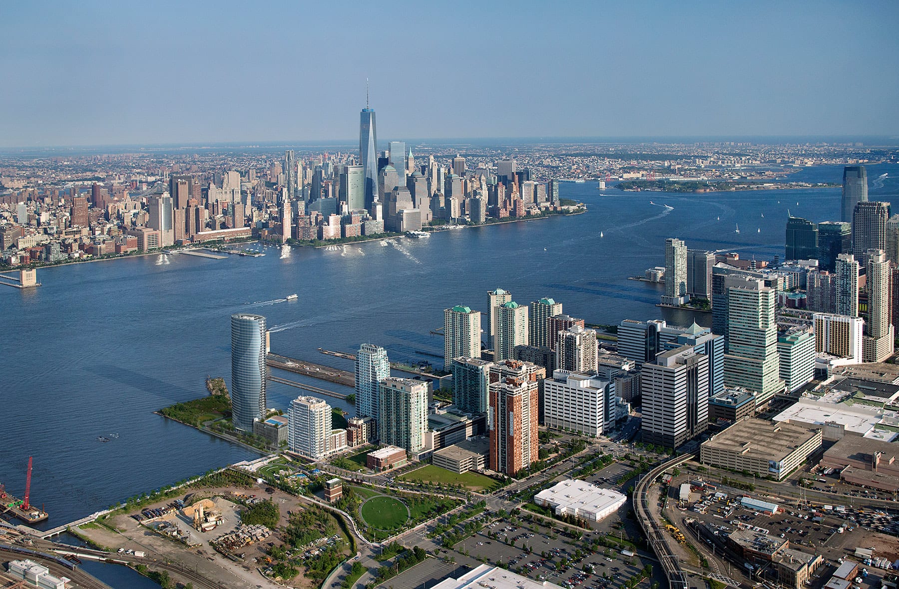 3D Render photomontage aerial view of waterfront city skyline with high rise buildings river urban development and realistic integration into existing city environment