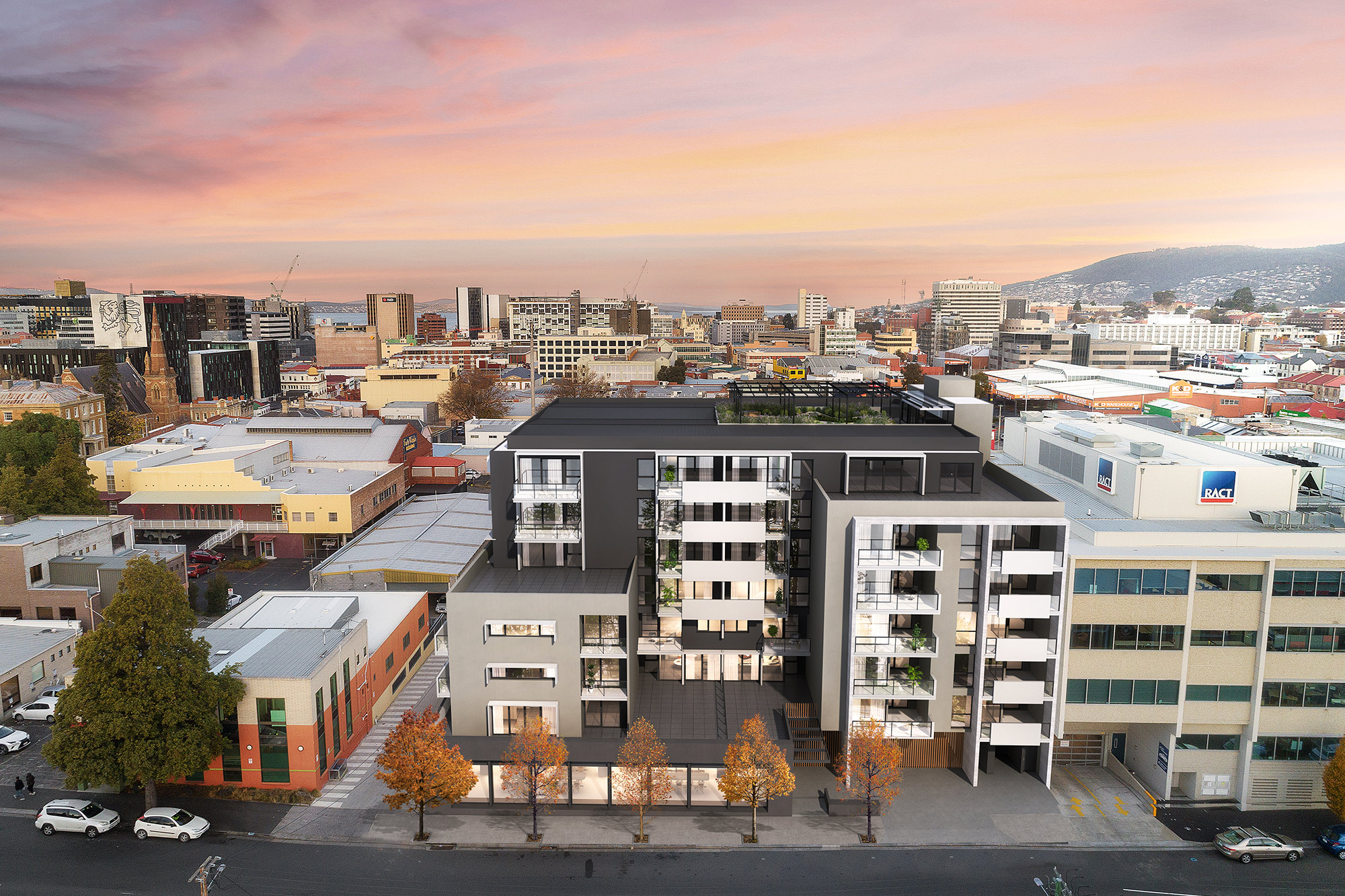 3D Render photomontage of modern apartment building in city center with balconies street frontage surrounding commercial buildings and urban skyline at sunset