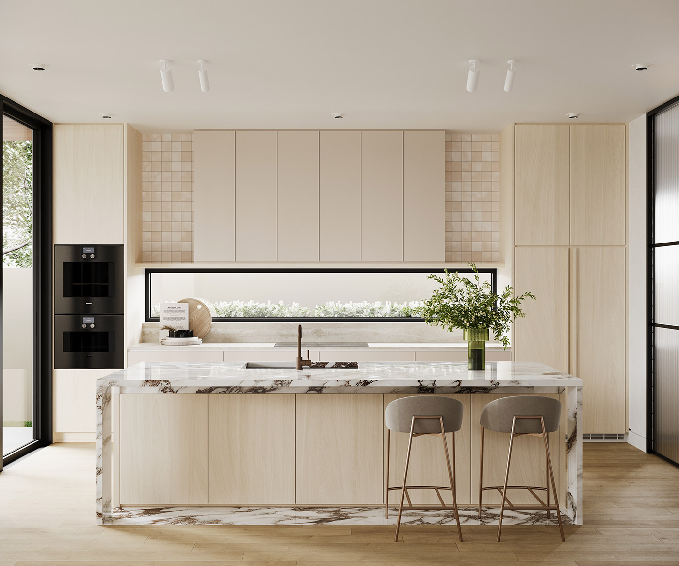 Modern kitchen with marble island, light wood cabinetry and minimalist design